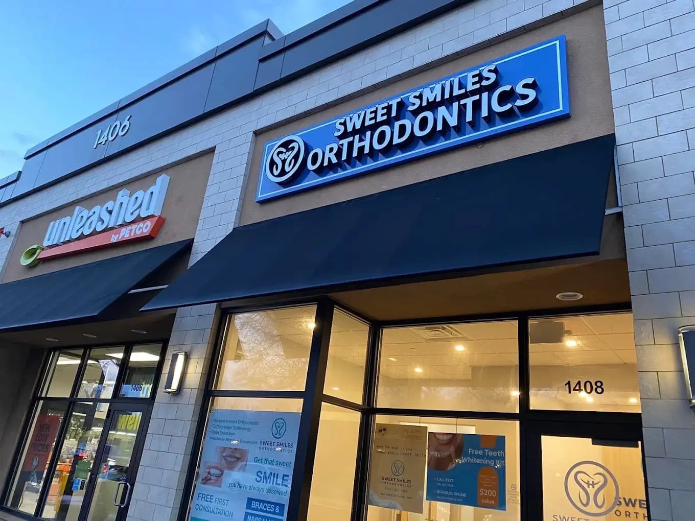 Located in Arlington, MA, Sweet Smiles Orthodontics features a bright blue storefront sign and is situated next to Unleashed by Petco at 1408.