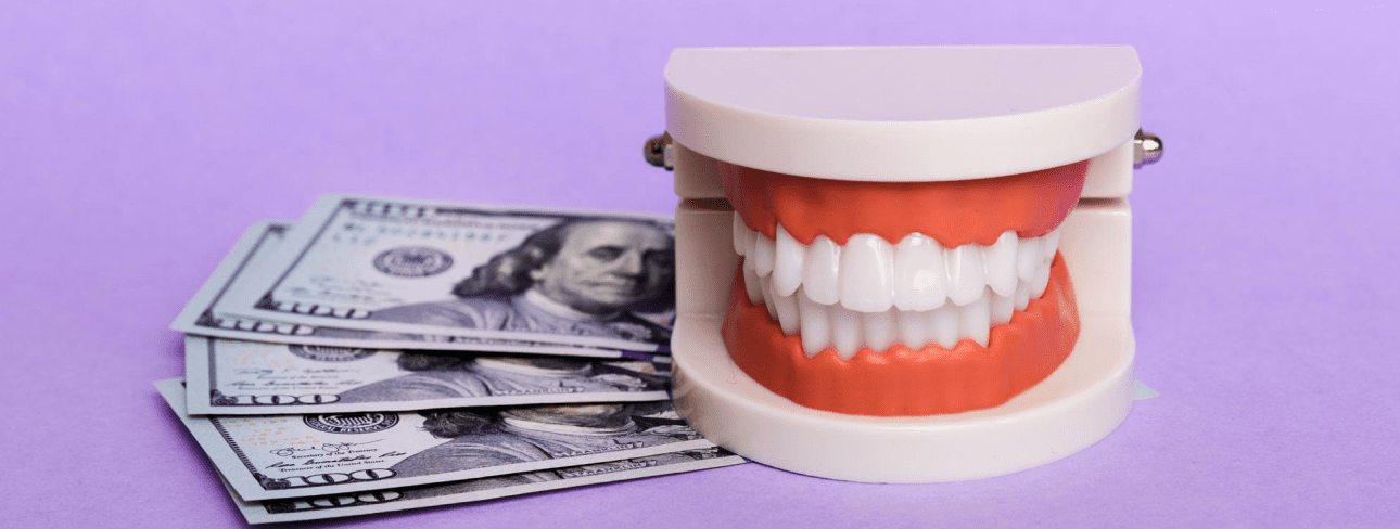 Clear braces on a dental model beside $100 bills, highlighting Sweet Smiles Orthodontics in Arlington, MA, on purple.