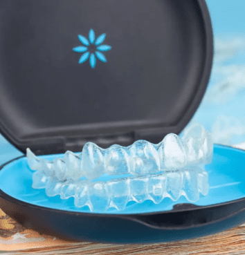 Set of clear Invisalign aligners in professional storage case, representing the complete treatment series made affordable through flexible payment plan options at Sweet Smiles Orthodontics in Arlington, MA