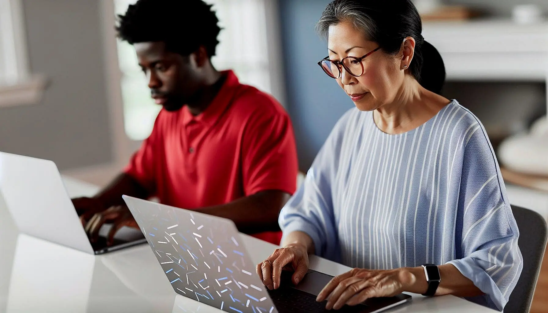 Professional woman wearing glasses working on laptop with digital interface elements, representing the modern technology and digital treatment planning used for affordable braces at Sweet Smiles Orthodontics in Arlington MA, with a colleague collaborating in the background